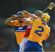 23 July 2021; Robbie O'Flynn of Cork is tackled by David McInerney, left, and Rory Hayes of Clare during the GAA Hurling All-Ireland Senior Championship Round 2 match between Clare and Cork at LIT Gaelic Grounds in Limerick. Photo by Eóin Noonan/Sportsfile