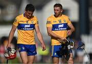 23 July 2021; Clare players John Conlon, left, and David McInerney leave the pitch after their side's defeat in the GAA Hurling All-Ireland Senior Championship Round 2 match between Clare and Cork at LIT Gaelic Grounds in Limerick. Photo by Piaras Ó Mídheach/Sportsfile