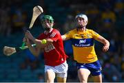 23 July 2021; Séamus Harnedy of Cork is hooked by Diarmuid Ryan of Clare as he prepares to shoot for a first half goal during the GAA Hurling All-Ireland Senior Championship Round 2 match between Clare and Cork at LIT Gaelic Grounds in Limerick. Photo by Piaras Ó Mídheach/Sportsfile