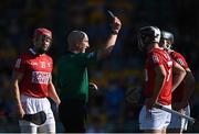 23 July 2021; Referee John Keenan appears to show the black card to Niall O'Leary, not pictured, before showing him a second yellow card, and then a red card, during the GAA Hurling All-Ireland Senior Championship Round 2 match between Clare and Cork at LIT Gaelic Grounds in Limerick. Photo by Piaras Ó Mídheach/Sportsfile