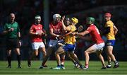 23 July 2021; Rory Hayes of Clare is tackled by Cork players Tim O'Mahony, left, and Séamus Harnedy during the GAA Hurling All-Ireland Senior Championship Round 2 match between Clare and Cork at LIT Gaelic Grounds in Limerick. Photo by Piaras Ó Mídheach/Sportsfile