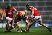 23 July 2021; Paul Flanagan in action against Robbie O'Flynn, left, and Alan Cadogan of Cork during the GAA Hurling All-Ireland Senior Championship Round 2 match between Clare and Cork at LIT Gaelic Grounds in Limerick. Photo by Piaras Ó Mídheach/Sportsfile