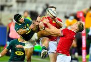 24 July 2021; Robbie Henshaw, hidden, and Duhan van der Merwe, right, of British and Irish Lions in action against Cheslin Kolbe of South Africa during the first test of the British and Irish Lions tour match between South Africa and British and Irish Lions at Cape Town Stadium in Cape Town, South Africa. Photo by Ashley Vlotman/Sportsfile