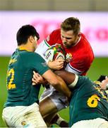 24 July 2021; Elliot Daly of British and Irish Lions is tackled by Damian de Allende, left, and Siya Kolisi of South Africa  during the first test of the British and Irish Lions tour match between South Africa and British and Irish Lions at Cape Town Stadium in Cape Town, South Africa. Photo by Ashley Vlotman/Sportsfile