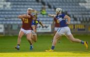 24 July 2021; Killian Doyle of Westmeath in action against James Keyes and Donnchadh Hartnett of Laois during the Allianz Hurling League Division 1 Relegation Play-off match between Laois and Westmeath at MW Hire O'Moore Park in Portlaoise, Co Laois. Photo by Harry Murphy/Sportsfile