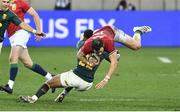 24 July 2021; Robbie Henshaw of the British and Irish Lions is  tackled by Elton Jantjies of South Africa during the first test of the British and Irish Lions tour match between South Africa and British and Irish Lions at Cape Town Stadium in Cape Town, South Africa. Photo by Ashley Vlotman/Sportsfile