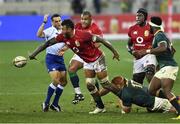 24 July 2021; Courtney Lawes of the British and Irish Lions offloads the ball as Steven Kitshoff of South Africa attempts a tackle during the first test of the British and Irish Lions tour match between South Africa and British and Irish Lions at Cape Town Stadium in Cape Town, South Africa. Photo by Ashley Vlotman/Sportsfile