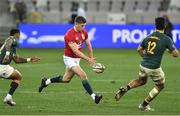24 July 2021; Owen Farrell of the British and Irish Lions kicks a ball through while under pressure from Elton Jantjies, left, and Damian de Allende of South Africa during the first test of the British and Irish Lions tour match between South Africa and British and Irish Lions at Cape Town Stadium in Cape Town, South Africa. Photo by Ashley Vlotman/Sportsfile