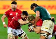 24 July 2021; Duhan van der Merwe, centre, is helped by team-mates Ali Price, left, and Jack Conan of British and Irish Lions after being tackled by Eben Etzebeth of South Africa during the first test of the British and Irish Lions tour match between South Africa and British and Irish Lions at Cape Town Stadium in Cape Town, South Africa. Photo by Ashley Vlotman/Sportsfile