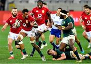 24 July 2021; Courtney Lawes of British and Irish Lions evades the tackle of Siya Kolisi of South Africa during the first test of the British and Irish Lions tour match between South Africa and British and Irish Lions at Cape Town Stadium in Cape Town, South Africa. Photo by Ashley Vlotman/Sportsfile