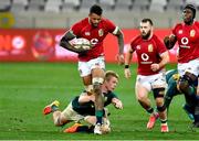 24 July 2021; Courtney Lawes of British and Irish Lions evades the tackle of Pieter Steph du Toit of South Africa during the first test of the British and Irish Lions tour match between South Africa and British and Irish Lions at Cape Town Stadium in Cape Town, South Africa. Photo by Ashley Vlotman/Sportsfile