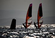 25 July 2021; Ingrid Puusta of Estonia, left, and Nikola Girke of Canada in action during the Women's Windsurfer races at the Enoshima Yacht Harbour during the 2020 Tokyo Summer Olympic Games in Tokyo, Japan. Photo by Stephen McCarthy/Sportsfile