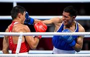 25 July 2021; Zakir Safiullin of Kazakhstan, blue, and Leodan Pezo Saboya of Peru during their Men's Lightweight Round of 32 bout at the Kokugikan Arena during the 2020 Tokyo Summer Olympic Games in Tokyo, Japan. Photo by Ramsey Cardy/Sportsfile