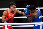 25 July 2021; Harry Garside of Australia, red, and John Ume of Papua New Guinea during their Men's Lightweight Round of 32 bout at the Kokugikan Arena during the 2020 Tokyo Summer Olympic Games in Tokyo, Japan. Photo by Ramsey Cardy/Sportsfile