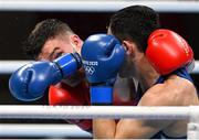 25 July 2021; Emmet Brennan of Ireland, red, in action against Dilshod Ruzmetov of Uzbekistan during the Men's Light Heavyweight Round of 32 at the Kokugikan Arena during the 2020 Tokyo Summer Olympic Games in Tokyo, Japan. Photo by Ramsey Cardy/Sportsfile