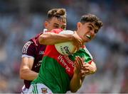 25 July 2021; Tommy Conroy of Mayo in action against Matthew Tierney of Galway during the Connacht GAA Senior Football Championship Final match between Galway and Mayo at Croke Park in Dublin. Photo by Ray McManus/Sportsfile