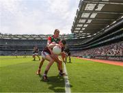 25 July 2021; Johnny Heaney of Galway keeps the ball in play under pressure from Bryan Walsh of Mayo during the Connacht GAA Senior Football Championship Final match between Galway and Mayo at Croke Park in Dublin. Photo by Ray McManus/Sportsfile