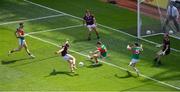 25 July 2021; Damien Comer of Galway scores his side's second goal past Rob Hennelly of Mayo during the Connacht GAA Senior Football Championship Final match between Galway and Mayo at Croke Park in Dublin. Photo by Daire Brennan/Sportsfile