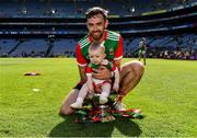 25 July 2021; Kevin McLoughlin of Mayo celebrates with his daughter Saorla, aged nine months, in the Nestor cup after the Connacht GAA Senior Football Championship Final match between Galway and Mayo at Croke Park in Dublin. Photo by Harry Murphy/Sportsfile
