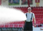 25 July 2021; A member of the Fire Brigade waters the pitch before the FAI Cup First Round match between Sligo Rovers and Cork City at The Showgrounds in Sligo. Photo by Michael P Ryan/Sportsfile