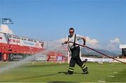 25 July 2021; A member of the Fire Brigade waters the pitch before the FAI Cup First Round match between Sligo Rovers and Cork City at The Showgrounds in Sligo. Photo by Michael P Ryan/Sportsfile