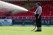 25 July 2021; A member of the Fire Brigade waters the pitch before the FAI Cup First Round match between Sligo Rovers and Cork City at The Showgrounds in Sligo. Photo by Michael P Ryan/Sportsfile