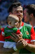 25 July 2021; Kevin McLoughlin of Mayo and his nine month old daughter Saorla watch the presentation after the Connacht GAA Senior Football Championship Final match between Galway and Mayo at Croke Park in Dublin. Photo by Ray McManus/Sportsfile