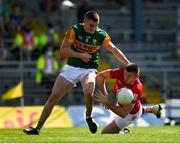 25 July 2021; Luke Connolly of Cork of Cork is tackled by Seán O’Shea of Kerry during the Munster GAA Football Senior Championship Final match between Kerry and Cork at Fitzgerald Stadium in Killarney, Kerry. Photo by Eóin Noonan/Sportsfile