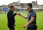 25 July 2021; Dundalk head coach Vinny Perth and Treaty United manager Tommy Barrett fist bump after the FAI Cup First Round match between Treaty United and Dundalk at Market's Field in Limerick. Photo by Diarmuid Greene/Sportsfile