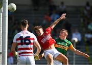 25 July 2021; Seán O’Shea of Kerry scores his side's third goal despite the efforts of Kevin O’Donovan of Cork during the Munster GAA Football Senior Championship Final match between Kerry and Cork at Fitzgerald Stadium in Killarney, Kerry. Photo by Eóin Noonan/Sportsfile
