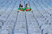 25 July 2021; Sisters Leah, left, and Cara Fahey, from Swinford, relax in the Cusack stand before the Connacht GAA Senior Football Championship Final match between Galway and Mayo at Croke Park in Dublin. Photo by Ray McManus/Sportsfile