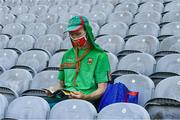 25 July 2021; Mayo supporter Seosamh Ó Maolchroim, from AghaGower, reaads his match programme before the Connacht GAA Senior Football Championship Final match between Galway and Mayo at Croke Park in Dublin. Photo by Ray McManus/Sportsfile