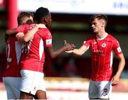 25 July 2021; Romeo Parkes of Sligo Rovers celebrates after scoring his side's first goal with team-mates Niall Morahan, right, and Mark Byrne during the FAI Cup First Round match between Sligo Rovers and Cork City at The Showgrounds in Sligo. Photo by Michael P Ryan/Sportsfile