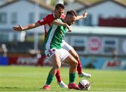 25 July 2021; Dylan McGlade of Cork City in action against Regan Donelon of Sligo Rovers during the FAI Cup First Round match between Sligo Rovers and Cork City at The Showgrounds in Sligo. Photo by Michael P Ryan/Sportsfile