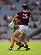 25 July 2021; Ryan O'Donoghue of Mayo is tackled by Seán Mulkerrin of Galway during the Connacht GAA Senior Football Championship Final match between Galway and Mayo at Croke Park in Dublin. Photo by Ray McManus/Sportsfile