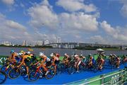 26 July 2021; The peloton passes Rainbow Bridge during the Men's Triathlon at the Odaiba Marine Park during the 2020 Tokyo Summer Olympic Games in Tokyo, Japan. Photo by Ramsey Cardy/Sportsfile