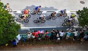 26 July 2021; A general view of the peleton as they pass spectators during the cycling discipline of the men's triathlon at the Odaiba Marine Park during the 2020 Tokyo Summer Olympic Games in Tokyo, Japan. Photo by Ramsey Cardy/Sportsfile