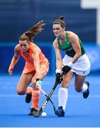 26 July 2021; Roisin Upton of Ireland in action against Lidewij Marsia Maria Weltenv during the women's pool A group stage match between Ireland and Netherlands at the Oi Hockey Stadium during the 2020 Tokyo Summer Olympic Games in Tokyo, Japan. Photo by Stephen McCarthy/Sportsfile