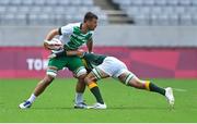 26 July 2021; Harry McNulty of Ireland is tackled by Impi Visser of South Africa during the rugby sevens men's pool C match between Ireland and South Africa at the Tokyo Stadium during the 2020 Tokyo Summer Olympic Games in Tokyo, Japan. Photo by Brendan Moran/Sportsfile