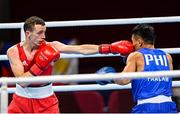 26 July 2021; Brendan Irvine of Ireland, left, and Carlo Paalam of Philippines during their Men's Flyweight Round of 32 bout at the Kokugikan Arena during the 2020 Tokyo Summer Olympic Games in Tokyo, Japan. Photo by Ramsey Cardy/Sportsfile