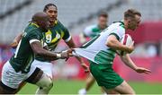 26 July 2021; Terry Kennedy of Ireland is tackled by of Siviwe Soyizwapi of South Africa during the rugby sevens men's pool C match between Ireland and South Africa at the Tokyo Stadium during the 2020 Tokyo Summer Olympic Games in Tokyo, Japan. Photo by Brendan Moran/Sportsfile