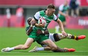 26 July 2021; Terry Kennedy of Ireland is tackled by of Siviwe Soyizwapi of South Africa during the rugby sevens men's pool C match between Ireland and South Africa at the Tokyo Stadium during the 2020 Tokyo Summer Olympic Games in Tokyo, Japan. Photo by Brendan Moran/Sportsfile