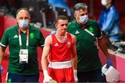 26 July 2021; Brendan Irvine of Ireland, centre, with coaches Zaur Antia, left, and John Conlan, after defeat to Carlo Paalam of Philippines in their Men's Flyweight Round of 32 bout at the Kokugikan Arena during the 2020 Tokyo Summer Olympic Games in Tokyo, Japan. Photo by Ramsey Cardy/Sportsfile