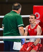 26 July 2021; Brendan Irvine of Ireland listens to instructions from coach Zaur Antia between rounds during his Men's Flyweight Round of 32 bout against Carlo Paalam of Philippines at the Kokugikan Arena during the 2020 Tokyo Summer Olympic Games in Tokyo, Japan. Photo by Ramsey Cardy/Sportsfile