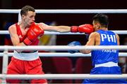 26 July 2021; Brendan Irvine of Ireland, left, and Carlo Paalam of Philippines during their Men's Flyweight Round of 32 bout at the Kokugikan Arena during the 2020 Tokyo Summer Olympic Games in Tokyo, Japan. Photo by Ramsey Cardy/Sportsfile