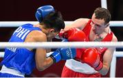 26 July 2021; Brendan Irvine of Ireland, red, and Carlo Paalam of Philippines during their Men's Flyweight Round of 32 bout at the Kokugikan Arena during the 2020 Tokyo Summer Olympic Games in Tokyo, Japan. Photo by Ramsey Cardy/Sportsfile