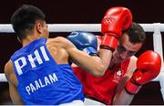 26 July 2021; Brendan Irvine of Ireland, red, and Carlo Paalam of Philippines during their Men's Flyweight Round of 32 bout at the Kokugikan Arena during the 2020 Tokyo Summer Olympic Games in Tokyo, Japan. Photo by Ramsey Cardy/Sportsfile