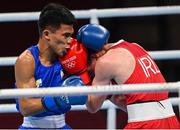 26 July 2021; Brendan Irvine of Ireland, red, and Carlo Paalam of Philippines during their Men's Flyweight Round of 32 bout at the Kokugikan Arena during the 2020 Tokyo Summer Olympic Games in Tokyo, Japan. Photo by Ramsey Cardy/Sportsfile