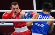 26 July 2021; Brendan Irvine of Ireland, red, and Carlo Paalam of Philippines during their Men's Flyweight Round of 32 bout at the Kokugikan Arena during the 2020 Tokyo Summer Olympic Games in Tokyo, Japan. Photo by Ramsey Cardy/Sportsfile