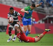 26 July 2021; Bolaca Napolioni of Fiji is tackled by Pat Kay of Canada during the rugby sevens men's pool B match between Fiji and Canada at the Tokyo Stadium during the 2020 Tokyo Summer Olympic Games in Tokyo, Japan. Photo by Stephen McCarthy/Sportsfile